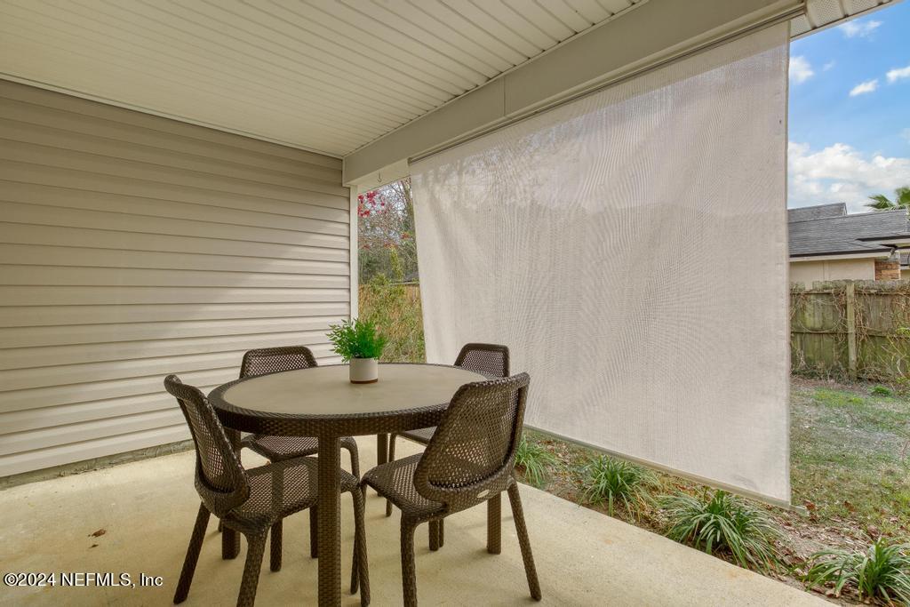 96014 Morton Lane Yulee, FL 32097 - Photo 42 of 45 a view of a outdoor seating area with furniture