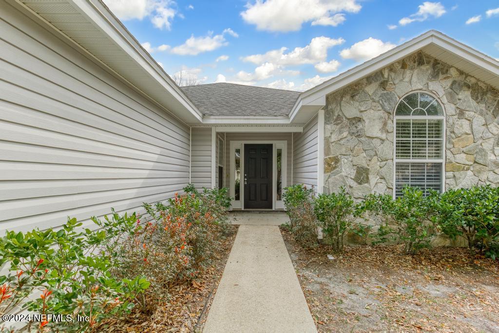 96014 Morton Lane Yulee, FL 32097 - Photo 5 of 45 a view of a brick house with plants