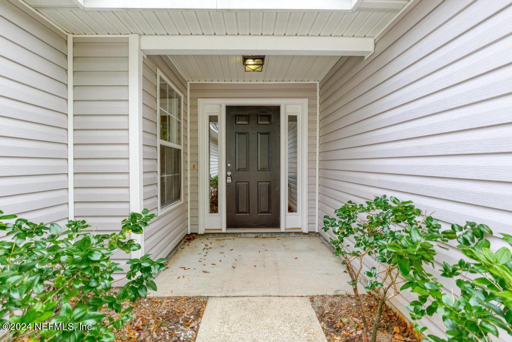 96014 Morton Lane Yulee, FL 32097 - Photo 6 of 45 a view of a entryway door front of house