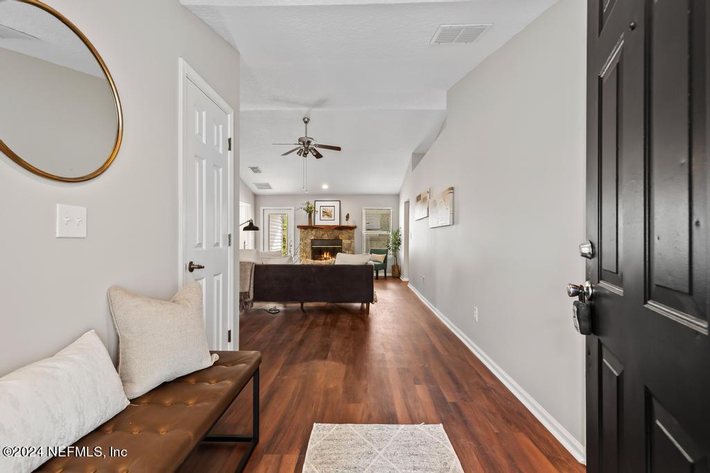 96014 Morton Lane Yulee, FL 32097 - Photo 7 of 45 a living room with furniture and a wooden floor