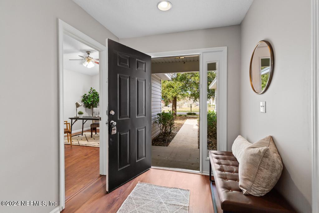 96014 Morton Lane Yulee, FL 32097 - Photo 8 of 45 a living room with furniture and a window
