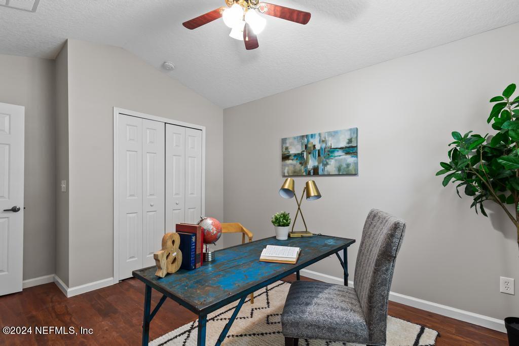 96014 Morton Lane Yulee, FL 32097 - Photo 10 of 45 a workspace with furniture and wooden floor