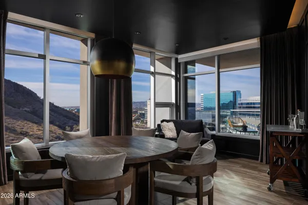 a kitchen with stainless steel appliances granite countertop a refrigerator a stove and a wooden floors