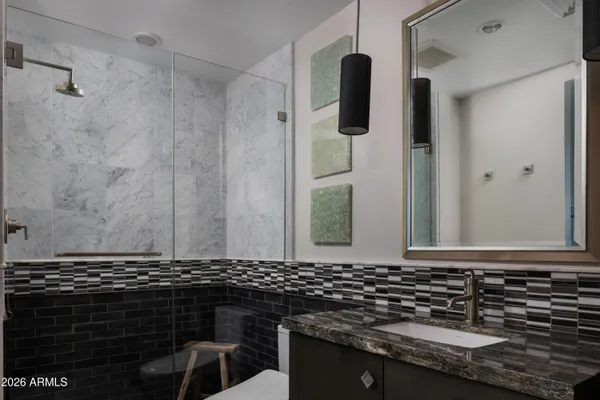 a bathroom with a sink and mirror