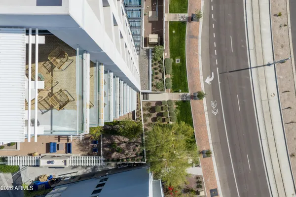 a view of building with swimming pool and sitting area