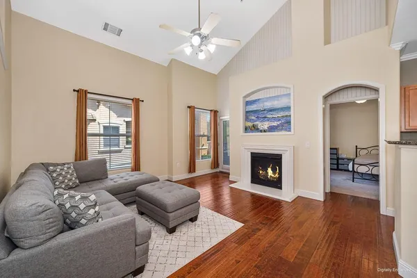 a living room with furniture and a fireplace