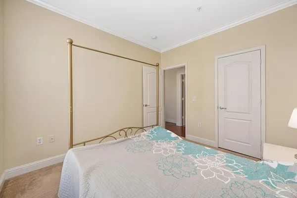 a bedroom with a bed and a shower