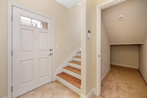 a view of a hallway with front door