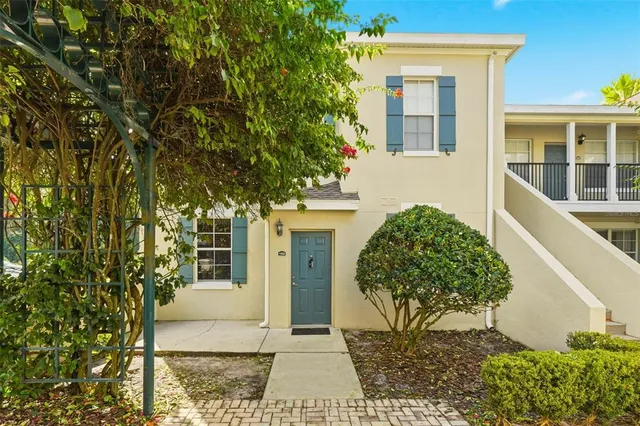 a view of a house with a tree