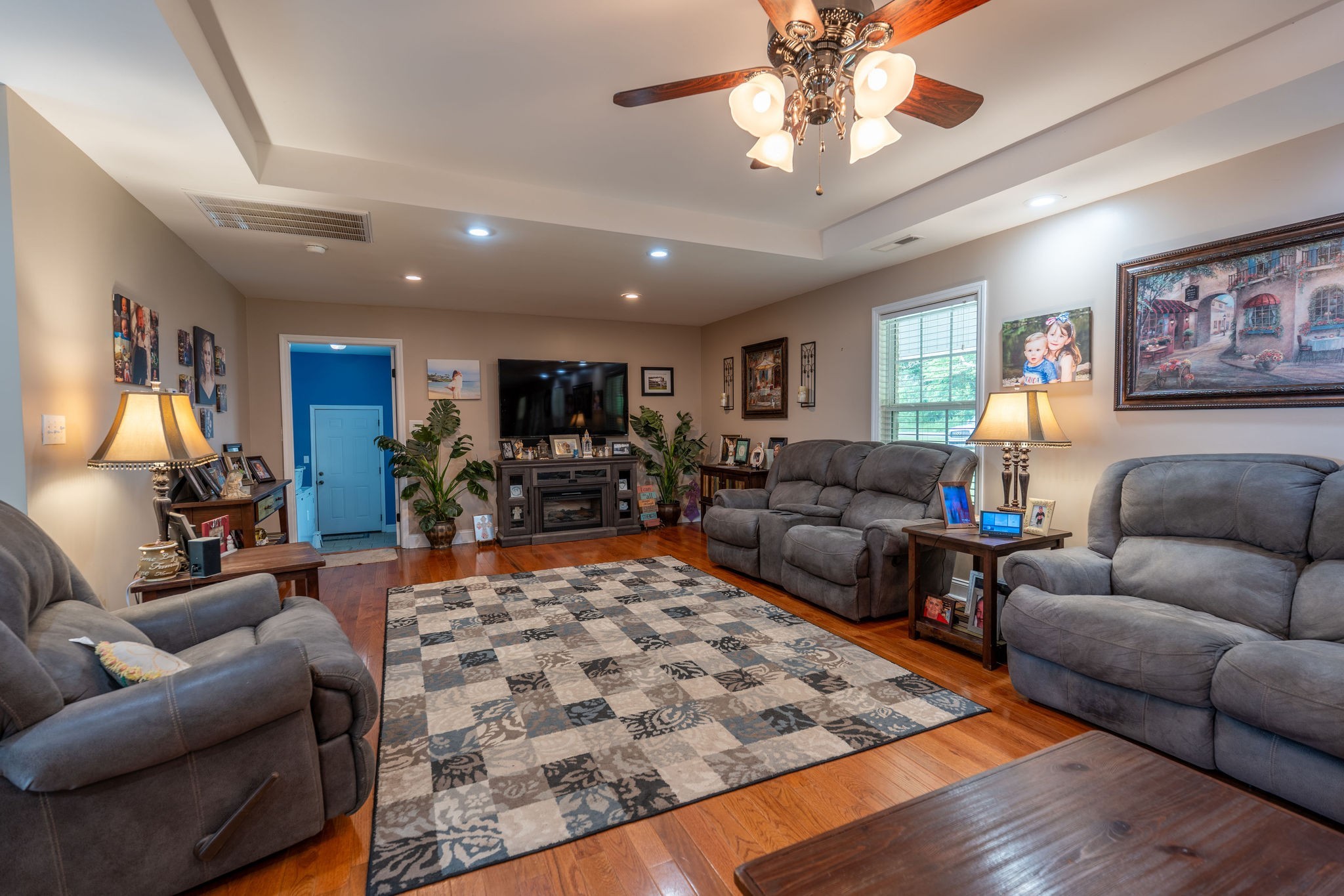 8276 Middle Butler Road Iron City, TN 38463 - Photo 11 of 27 a living room with furniture a rug and a chandelier