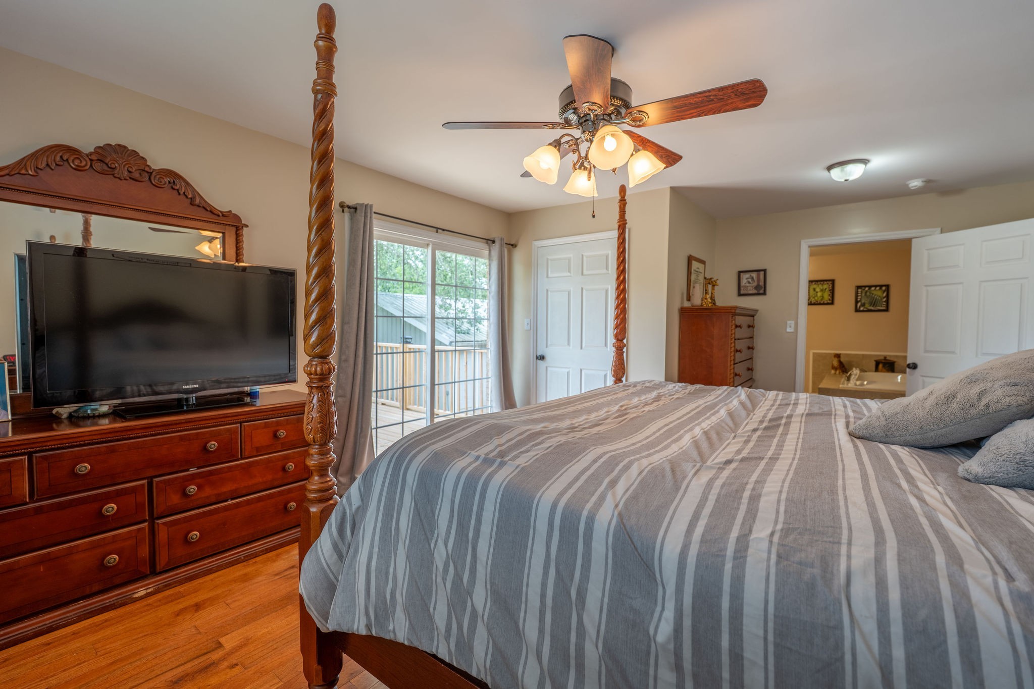 8276 Middle Butler Road Iron City, TN 38463 - Photo 18 of 27 a bedroom with a bed and a flat screen tv