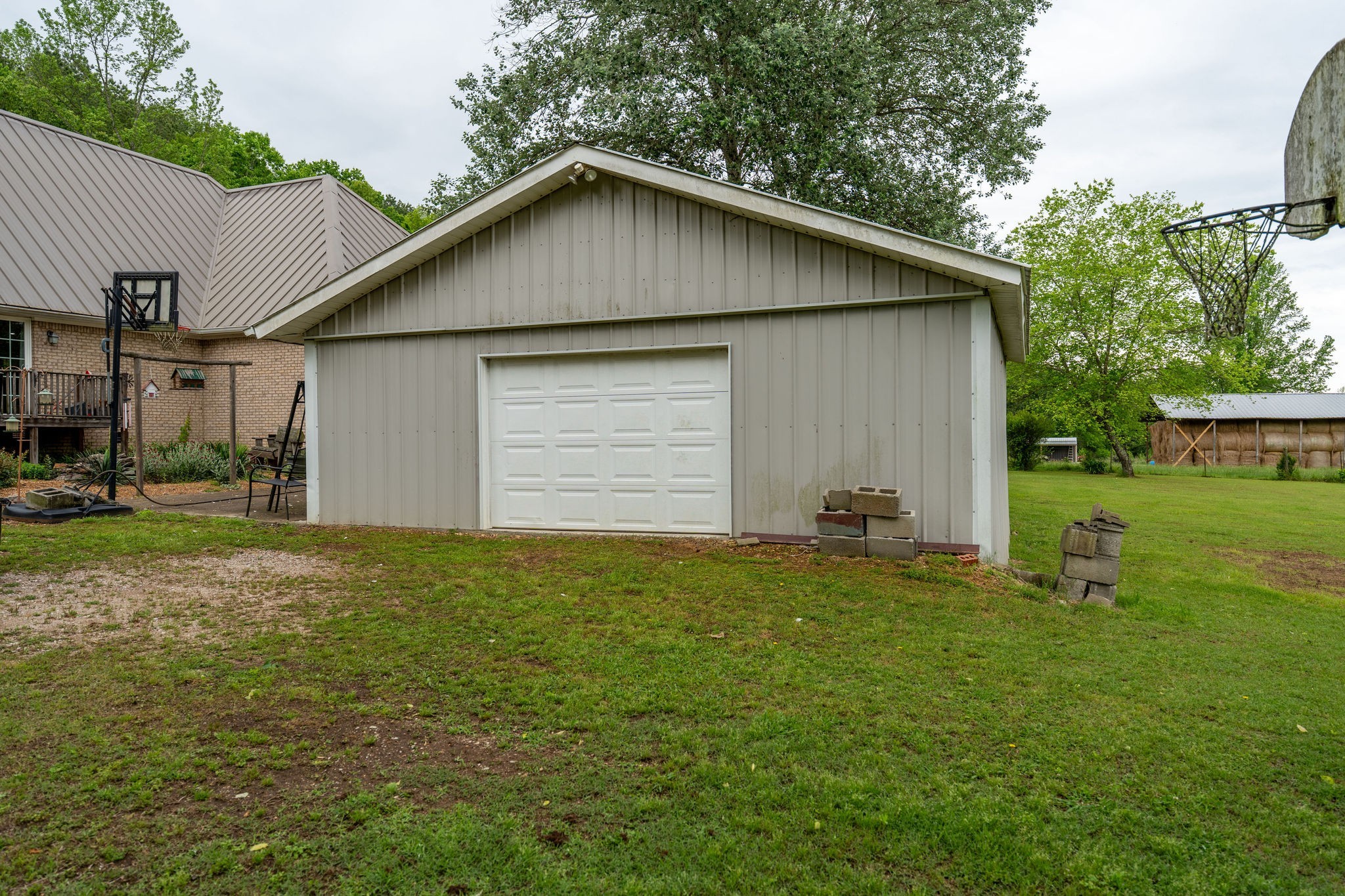 8276 Middle Butler Road Iron City, TN 38463 - Photo 7 of 27 a small white house with a yard and garage