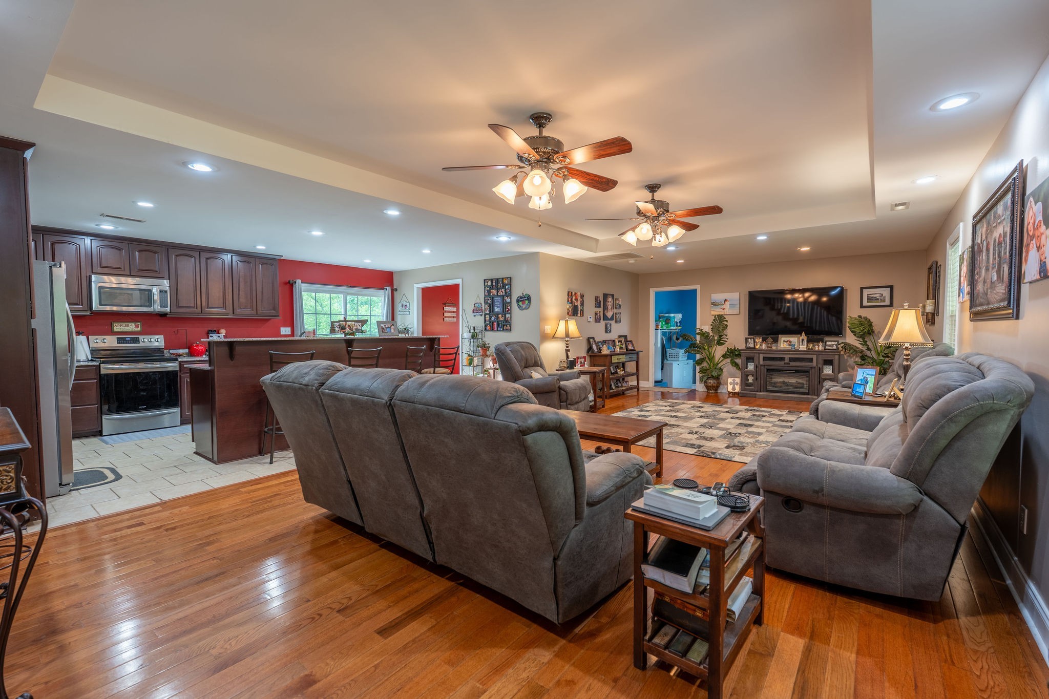8276 Middle Butler Road Iron City, TN 38463 - Photo 9 of 27 a living room with furniture kitchen view and a wooden floor