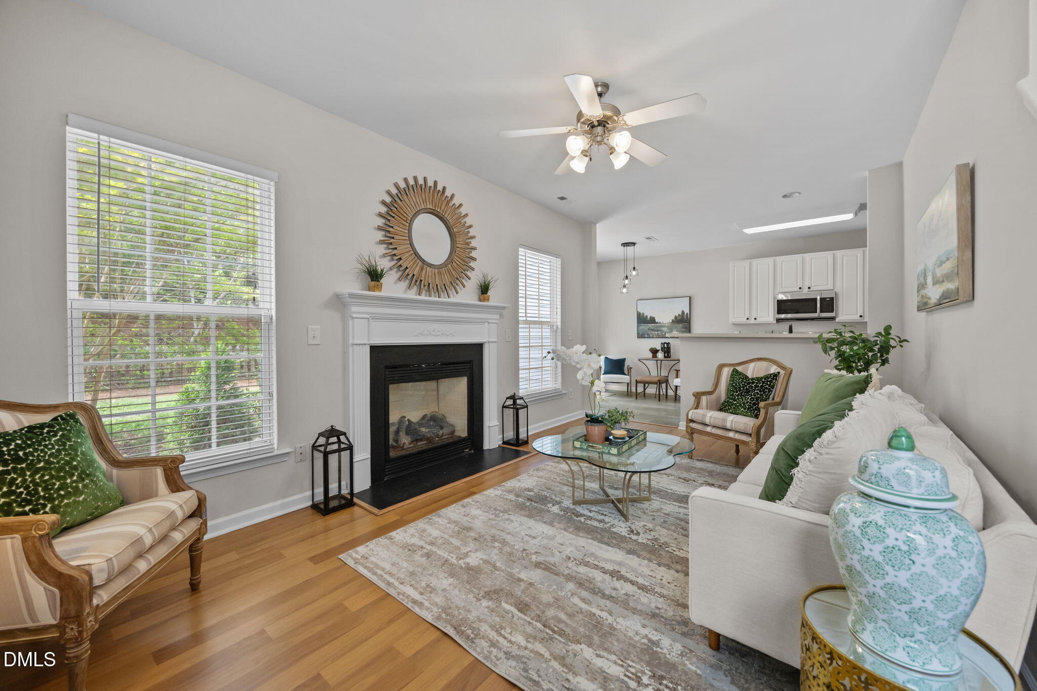 1003 Red Hat Lane Durham, NC 27713 - Photo 20 of 60 a living room with furniture a fireplace a flat screen tv and a large window