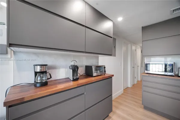 a kitchen with sink cabinets and appliances