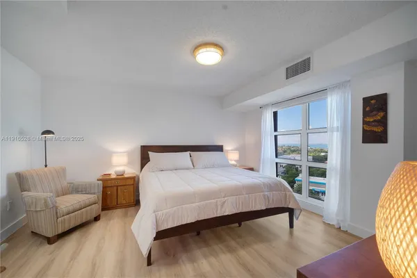 a bedroom with a bed and a couch