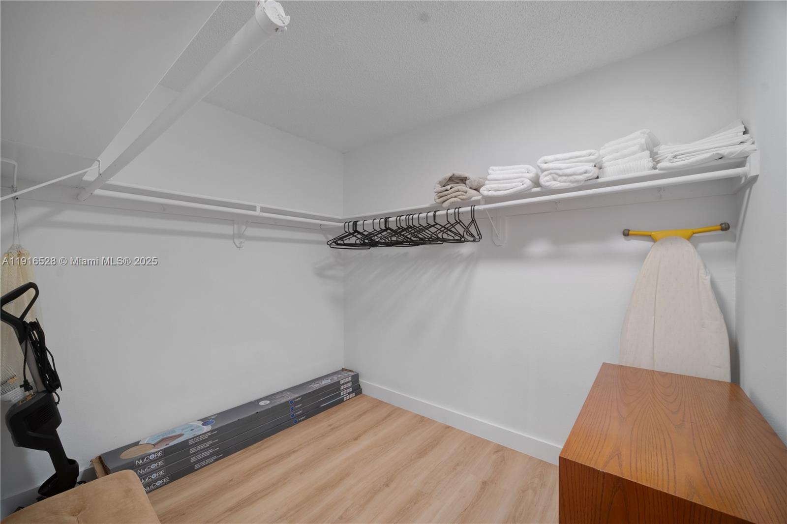 77 Crandon Boulevard, Unit 10C Key Biscayne, FL 33149 - Photo 22 of 37 a bathroom with a sink and a mirror