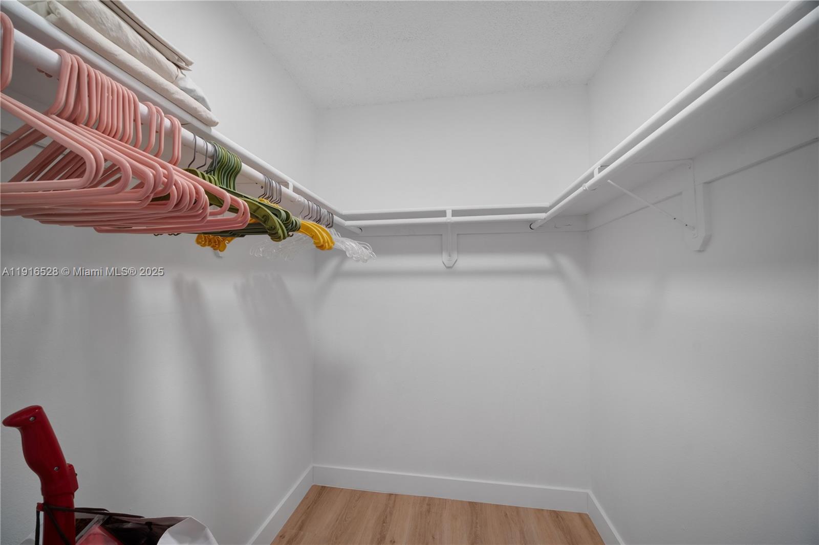 77 Crandon Boulevard, Unit 10C Key Biscayne, FL 33149 - Photo 25 of 37 a view of a room with racks on the wall