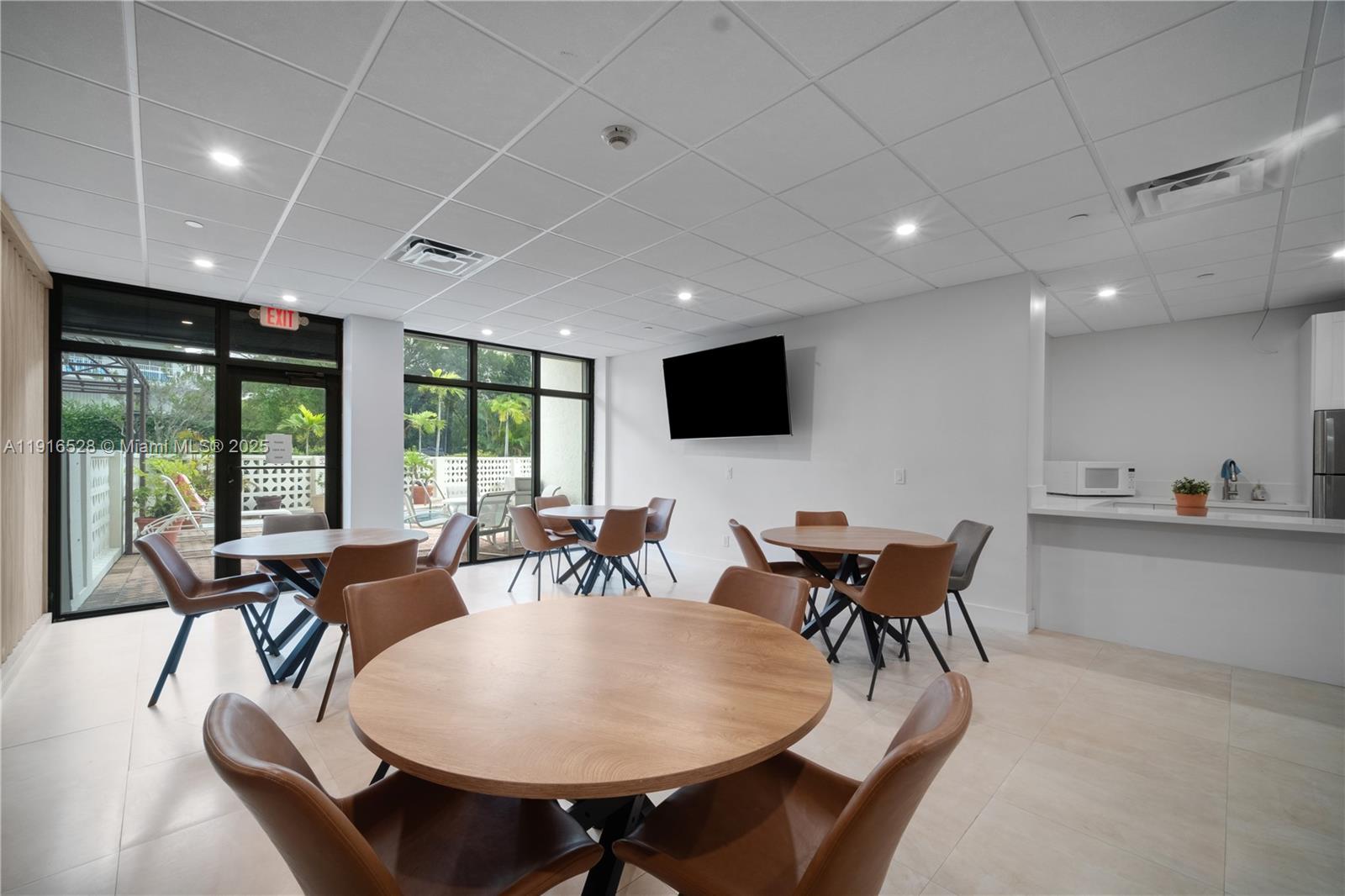 77 Crandon Boulevard, Unit 10C Key Biscayne, FL 33149 - Photo 29 of 37 a view of a dining room with furniture window and outside view