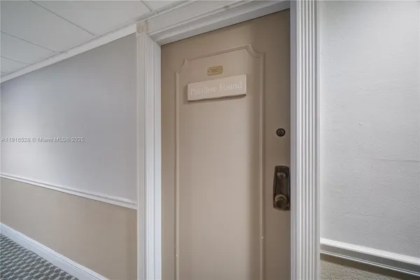 a walk in closet with a mirror