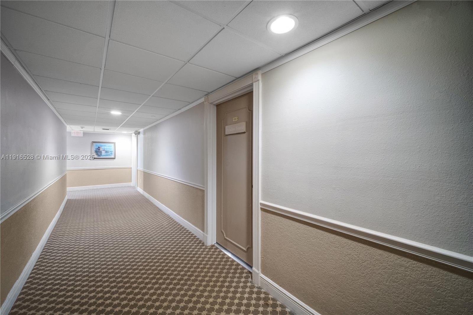 77 Crandon Boulevard, Unit 10C Key Biscayne, FL 33149 - Photo 4 of 37 a view of hallway with window