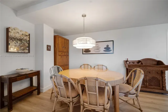 a kitchen with stainless steel appliances granite countertop a refrigerator a sink and a stove