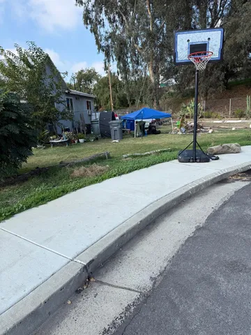 a view of street with parked cars