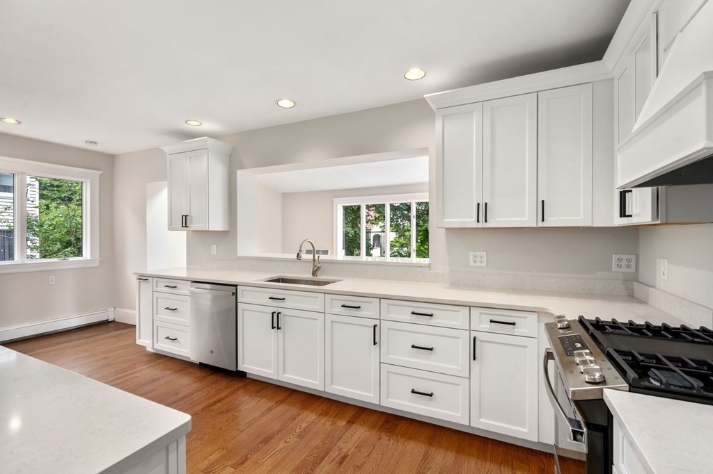 95 Russett Road Boston, MA 02132 - Photo 12 of 42 a kitchen with white cabinets stove and sink