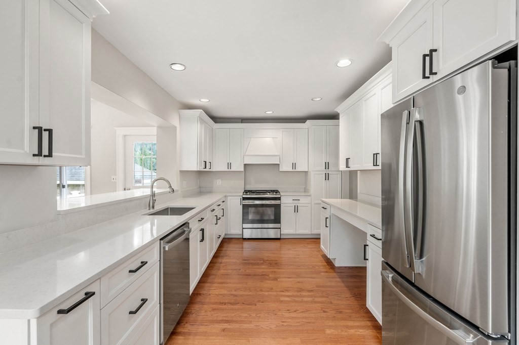 95 Russett Road Boston, MA 02132 - Photo 13 of 42 a large kitchen with stainless steel appliances a refrigerator and a sink