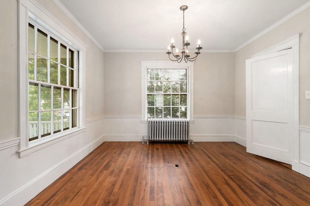 95 Russett Road Boston, MA 02132 - Photo 32 of 42 wooden floor in an empty room with a window