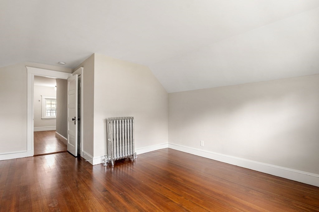 95 Russett Road Boston, MA 02132 - Photo 35 of 42 a view of a livingroom with wooden floor and staircase