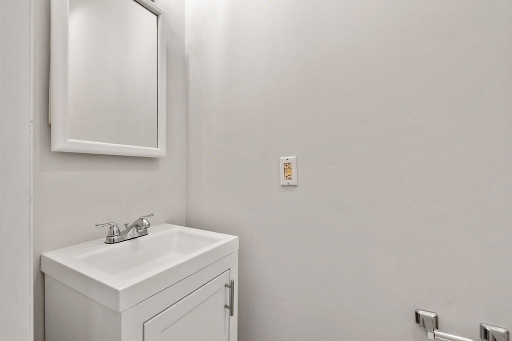 95 Russett Road Boston, MA 02132 - Photo 36 of 42 a bathroom with a sink and a mirror