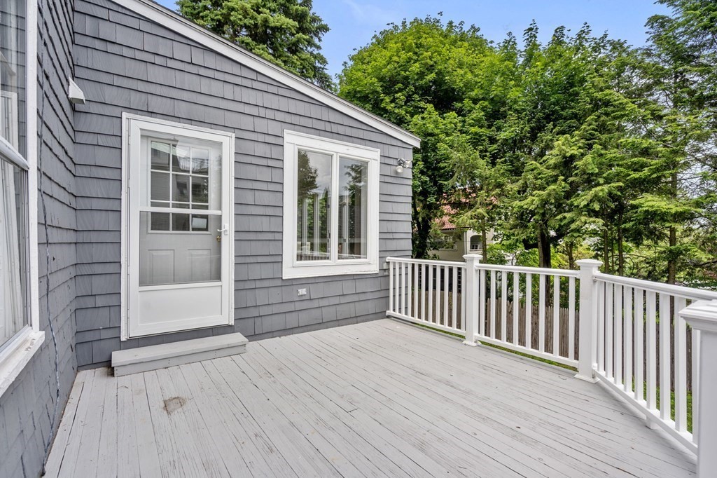 95 Russett Road Boston, MA 02132 - Photo 39 of 42 a view of backyard with a deck and wooden floor