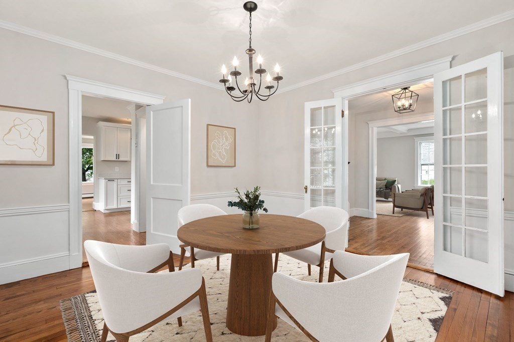 95 Russett Road Boston, MA 02132 - Photo 6 of 42 a dining room with furniture a chandelier and wooden floor