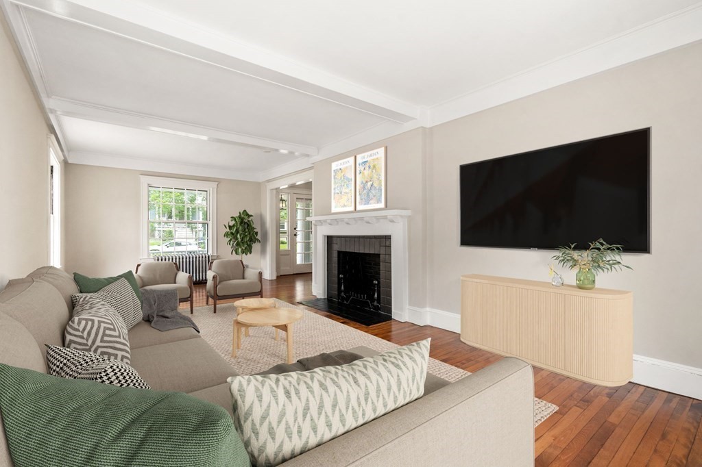 95 Russett Road Boston, MA 02132 - Photo 8 of 42 a living room with furniture a flat screen tv and a fireplace