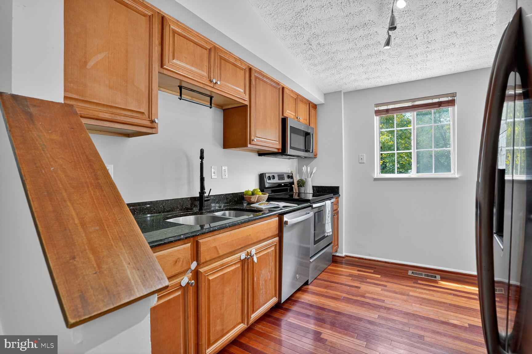 8763 Cold Plain Court Springfield, VA 22153 - Photo 33 of 132 Kitchen - Gleaming Hardwood Floors & Fresh Paint!