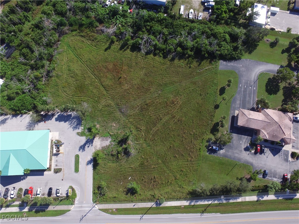 10250 Stringfellow Road St. James City, FL 33956 - Photo 6 of 8 an aerial view of a house with outdoor space and lake view