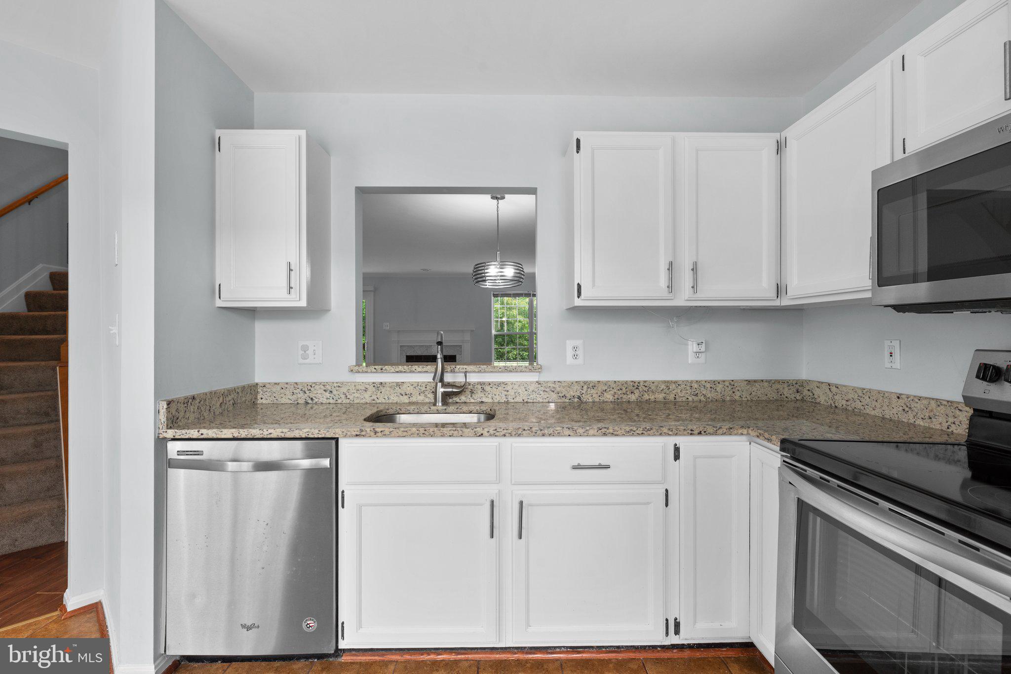 2204 Commissary Circle Odenton, MD 21113 - Photo 17 of 49 a kitchen with appliances cabinets and a sink