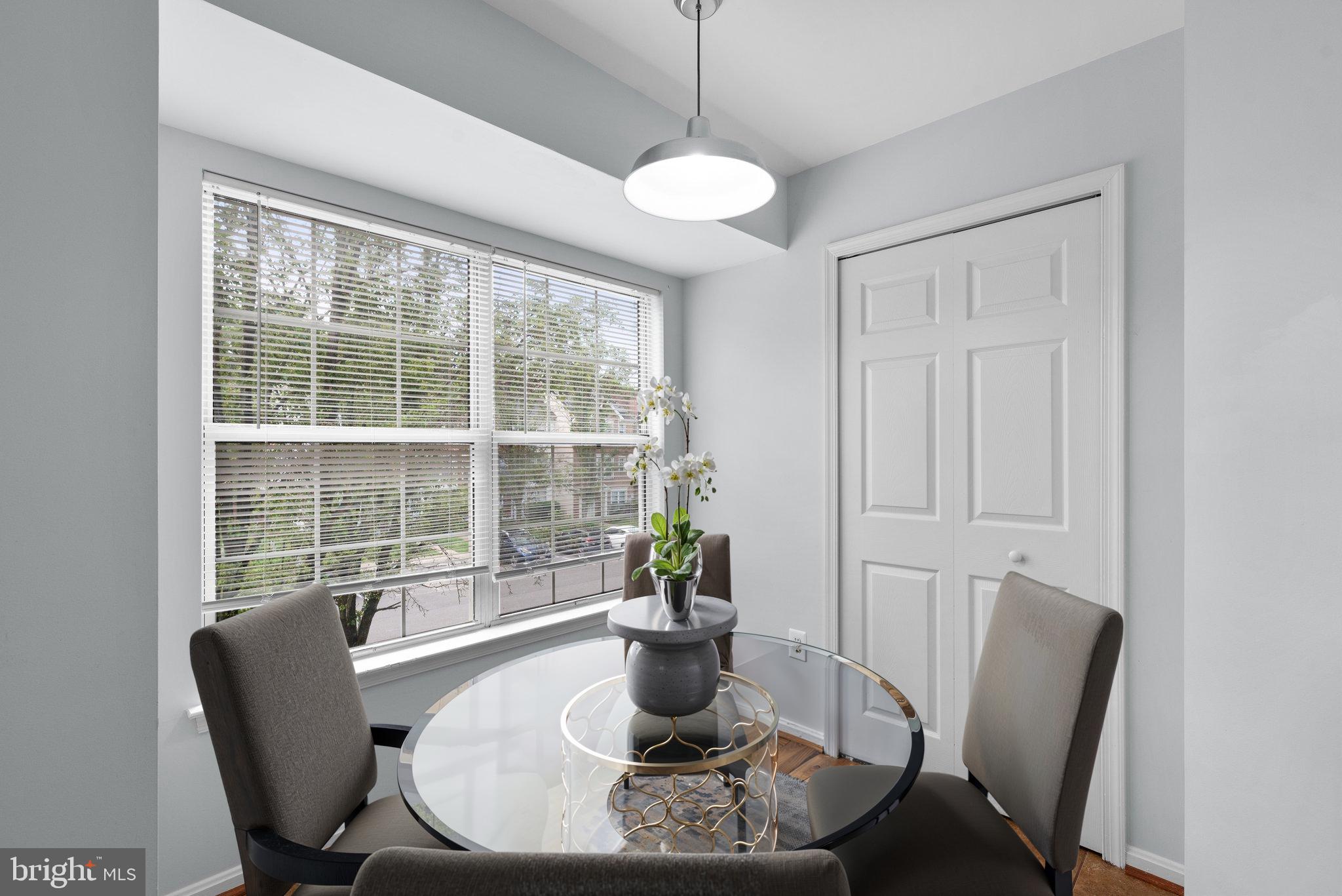 2204 Commissary Circle Odenton, MD 21113 - Photo 19 of 49 a dining room with furniture wooden floor and a potted plant