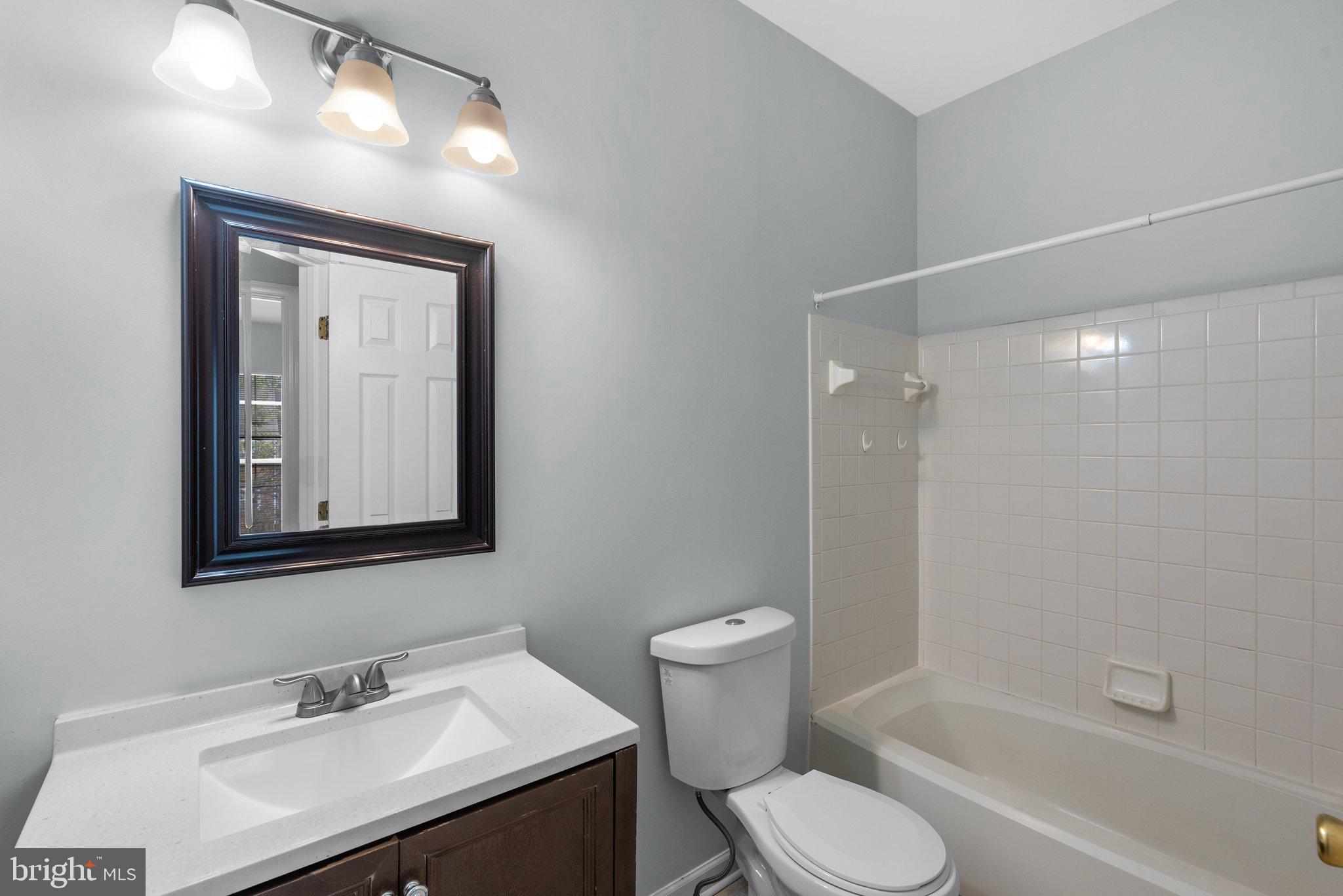 2204 Commissary Circle Odenton, MD 21113 - Photo 32 of 49 a bathroom with a sink toilet and shower