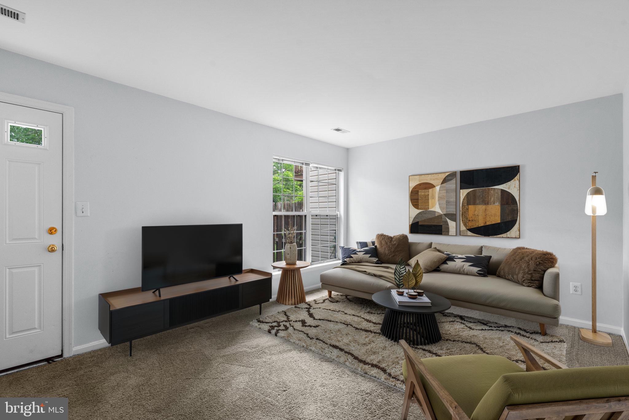 2204 Commissary Circle Odenton, MD 21113 - Photo 37 of 49 a living room with furniture and a flat screen tv