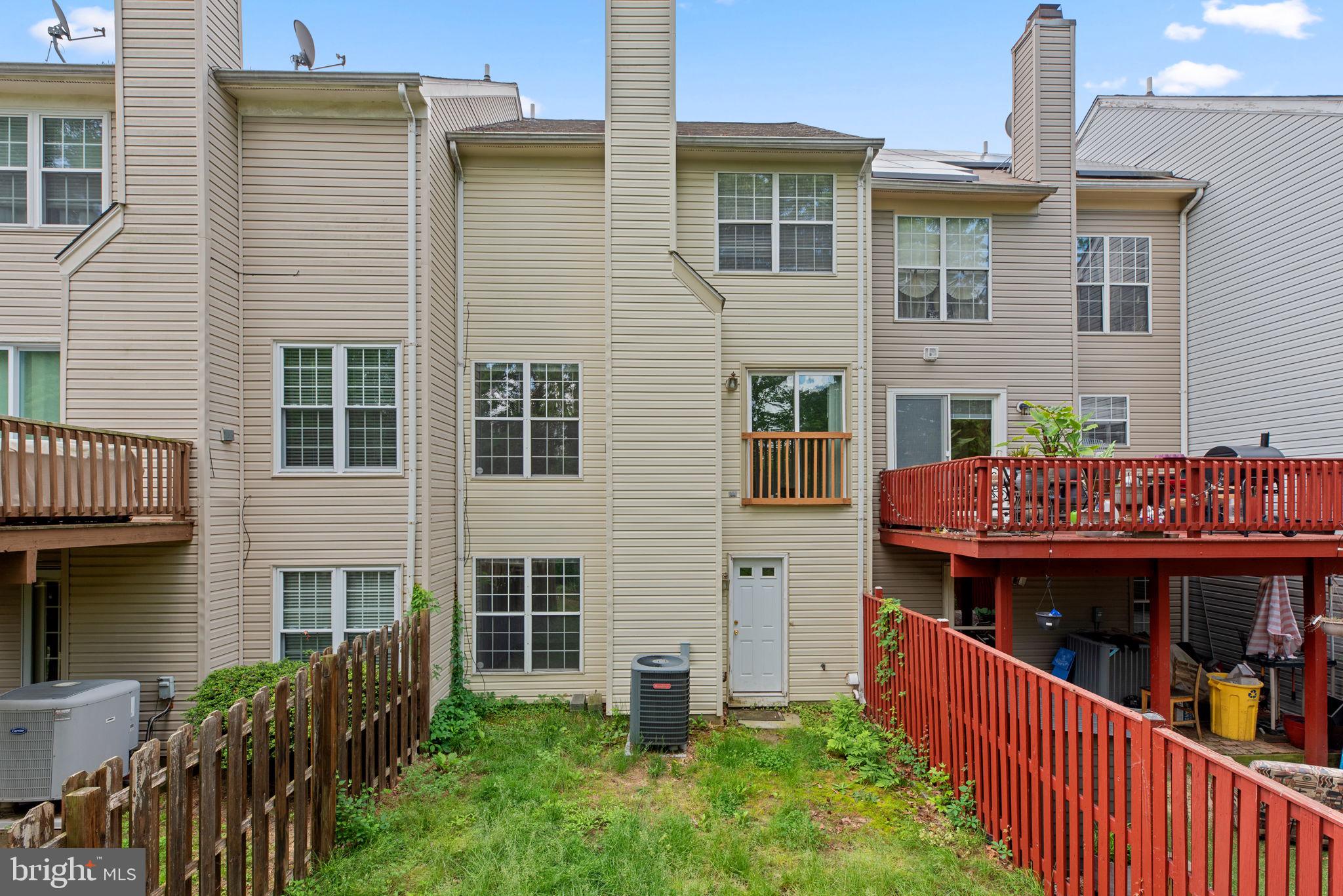 2204 Commissary Circle Odenton, MD 21113 - Photo 45 of 49 a view of a house with wooden deck and furniture