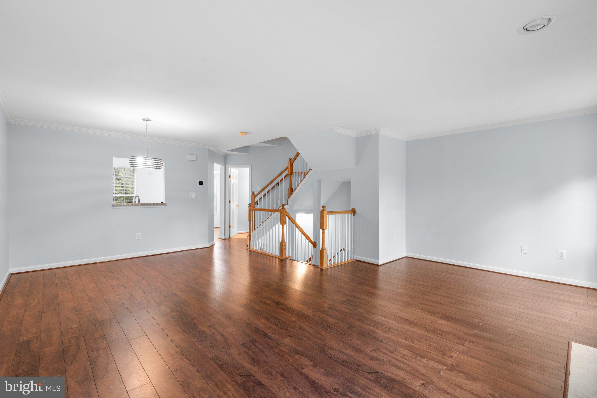 2204 Commissary Circle Odenton, MD 21113 - Photo 10 of 49 a view of an empty room with wooden floor and a window