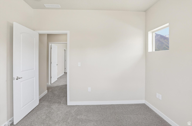 1838 West 300th Street South, Unit B Mapleton, UT 84664 - Photo 25 of 51 Interior room featuring light gray carpet flooring, white baseboards, and a neutral wall color