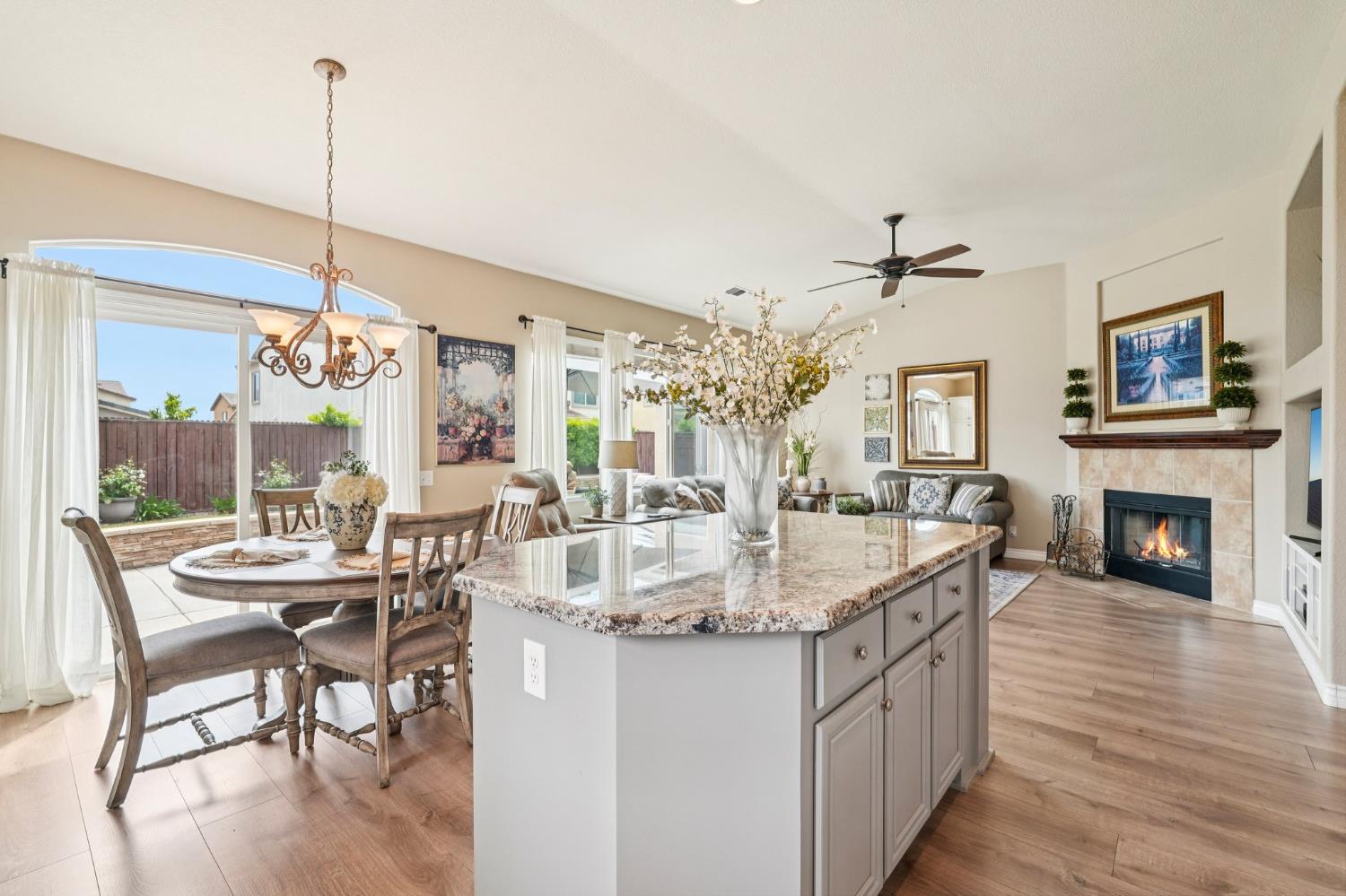 164 Legacy Street Manteca, CA 95337 - Photo 12 of 33 a dining table chairs with a chandelier