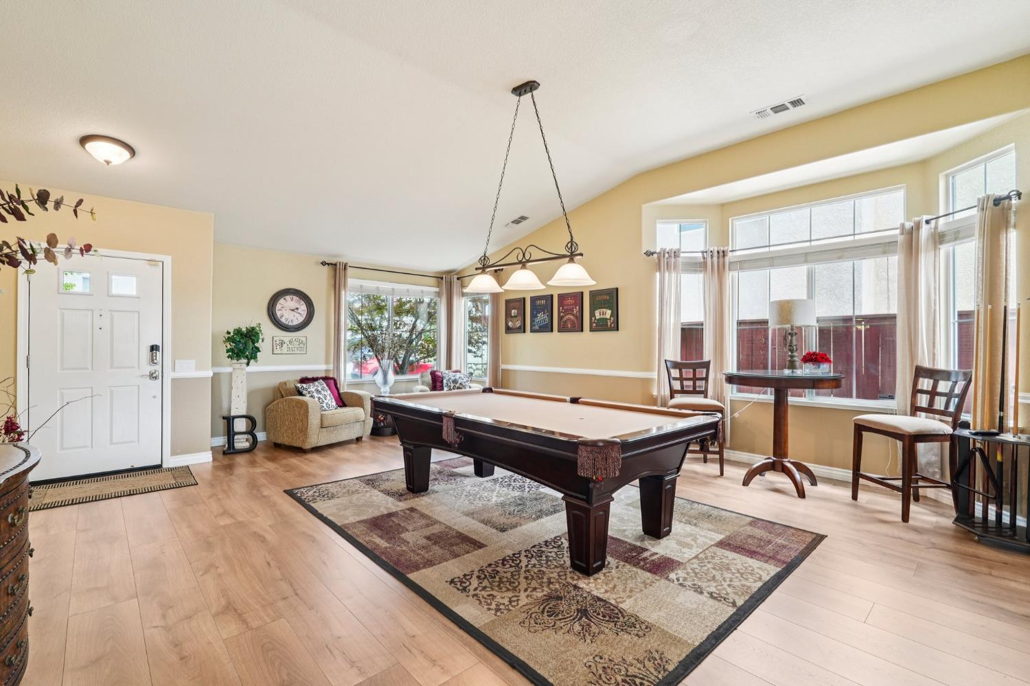 164 Legacy Street Manteca, CA 95337 - Photo 15 of 33 a living room filled with furniture and a table