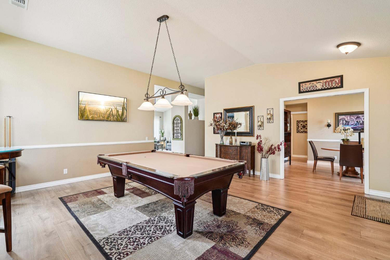 164 Legacy Street Manteca, CA 95337 - Photo 16 of 33 a room with lots of furniture a rug and a table