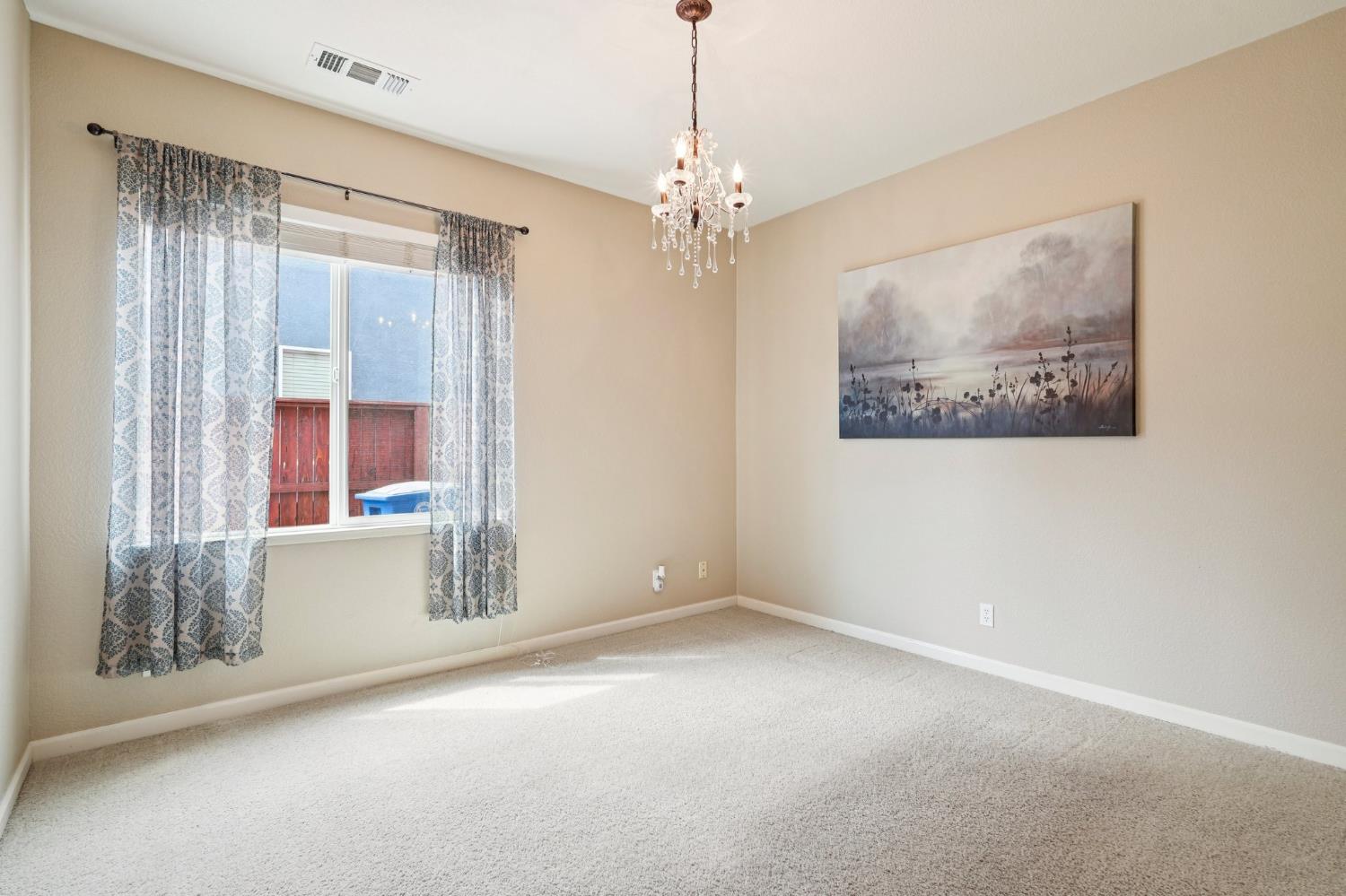164 Legacy Street Manteca, CA 95337 - Photo 22 of 33 a view of livingroom with window