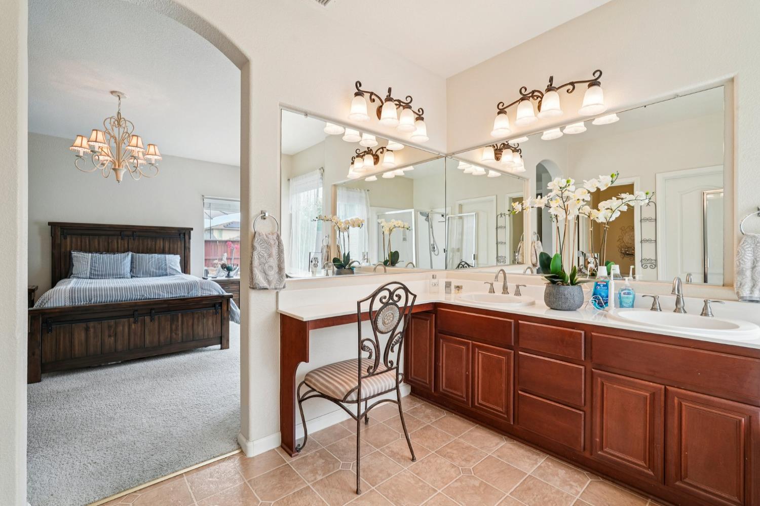 164 Legacy Street Manteca, CA 95337 - Photo 29 of 33 a spacious en suite bathroom with a double vanity sink and a mirror
