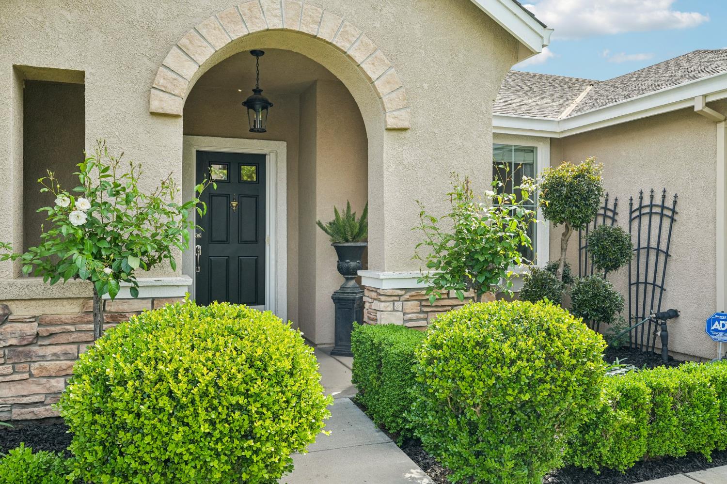 164 Legacy Street Manteca, CA 95337 - Photo 4 of 33 a house view with a garden space